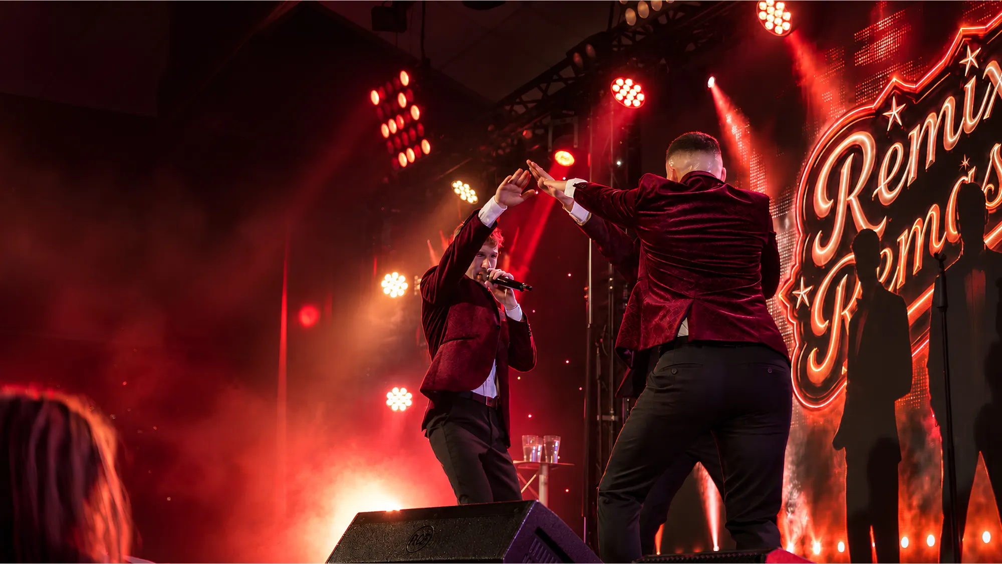 Remixed Remastered performing across a brightly lit stage