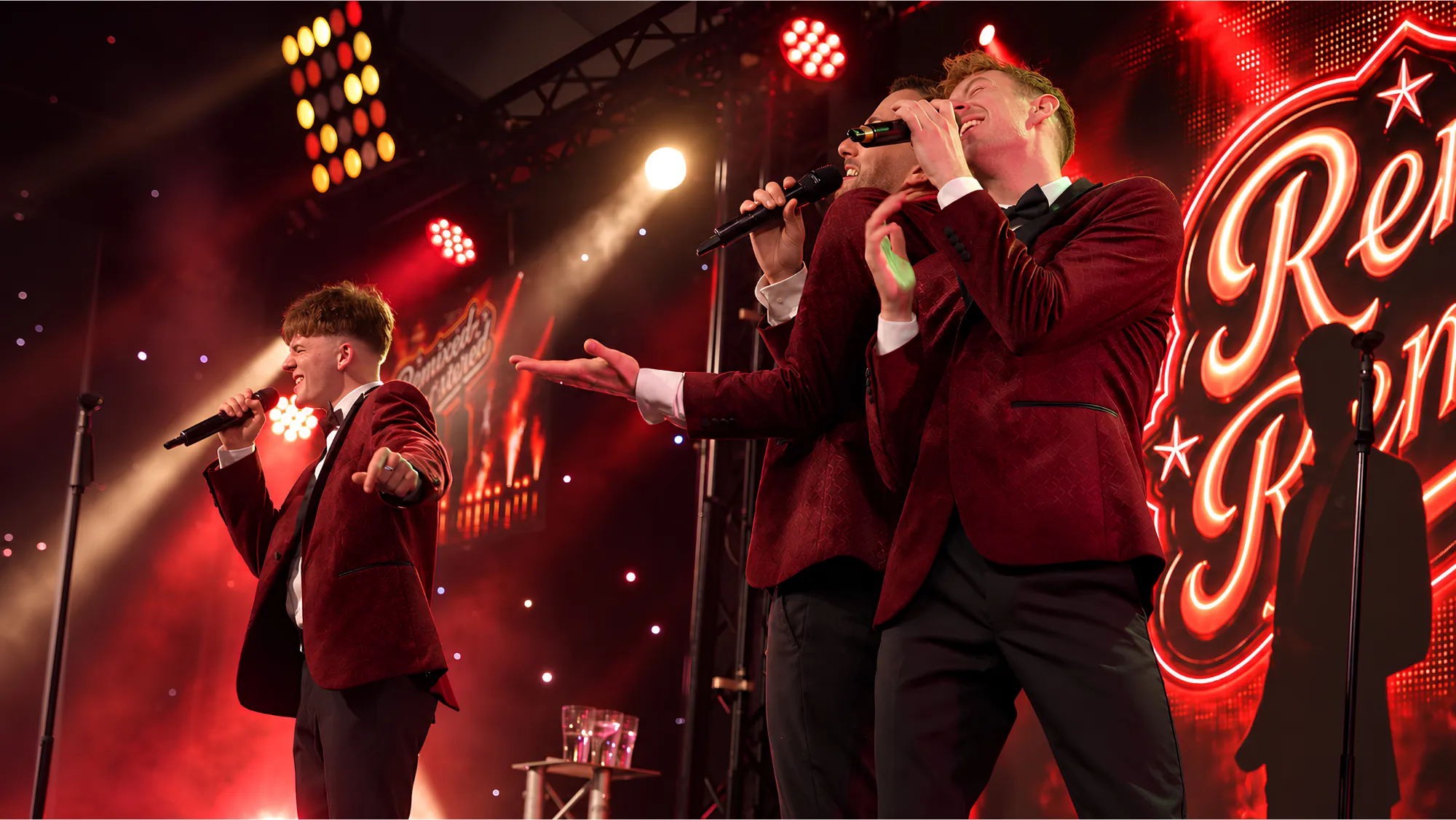 Two members of Remixed Remastered performing in front of the LED stage backdrop